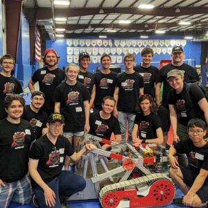 The team poses with their robot, ELE.
